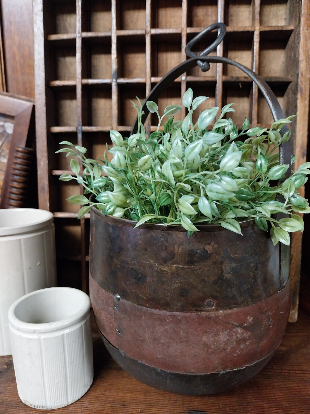 Rustic metal planter with handle