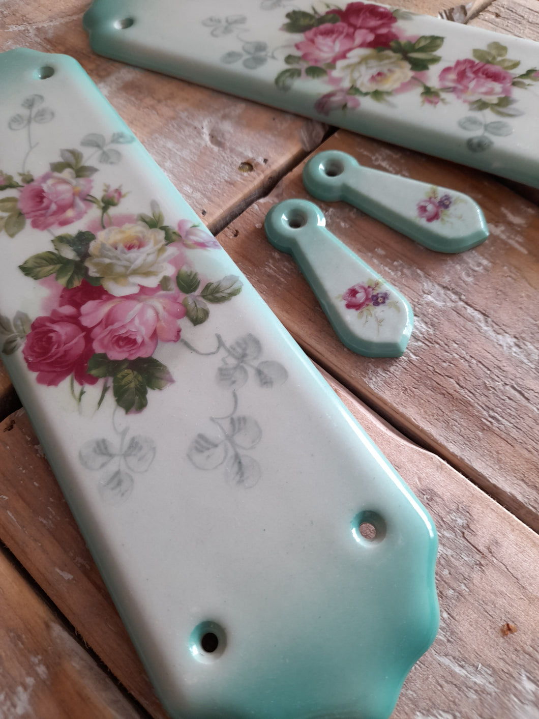 Pair of vintage porcelain finger plates with  matching key hole covers